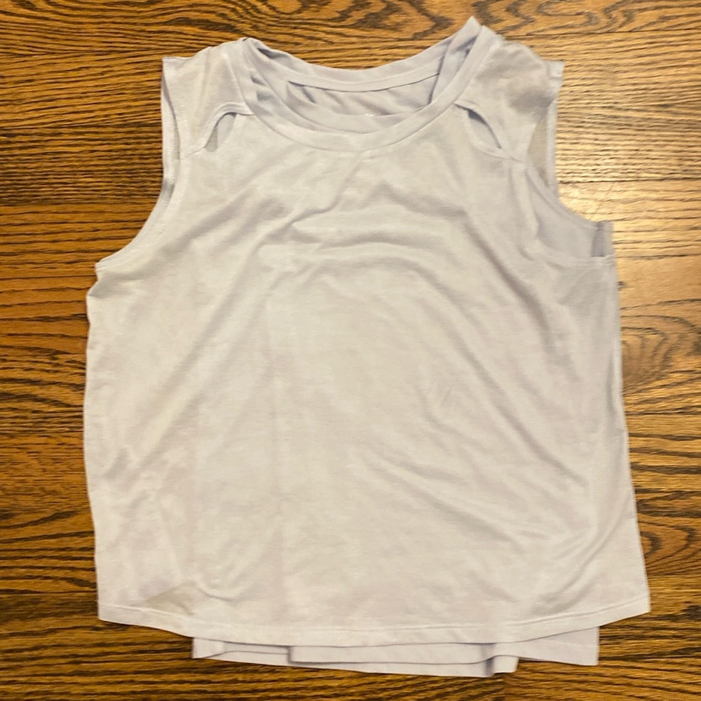 Baby blue tank top cut-out in back.